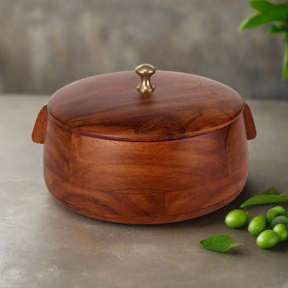 Round wooden roti box with a brass knob on the lid, designed with smooth curved edges. The box features a rich, polished finish in natural wood tones.