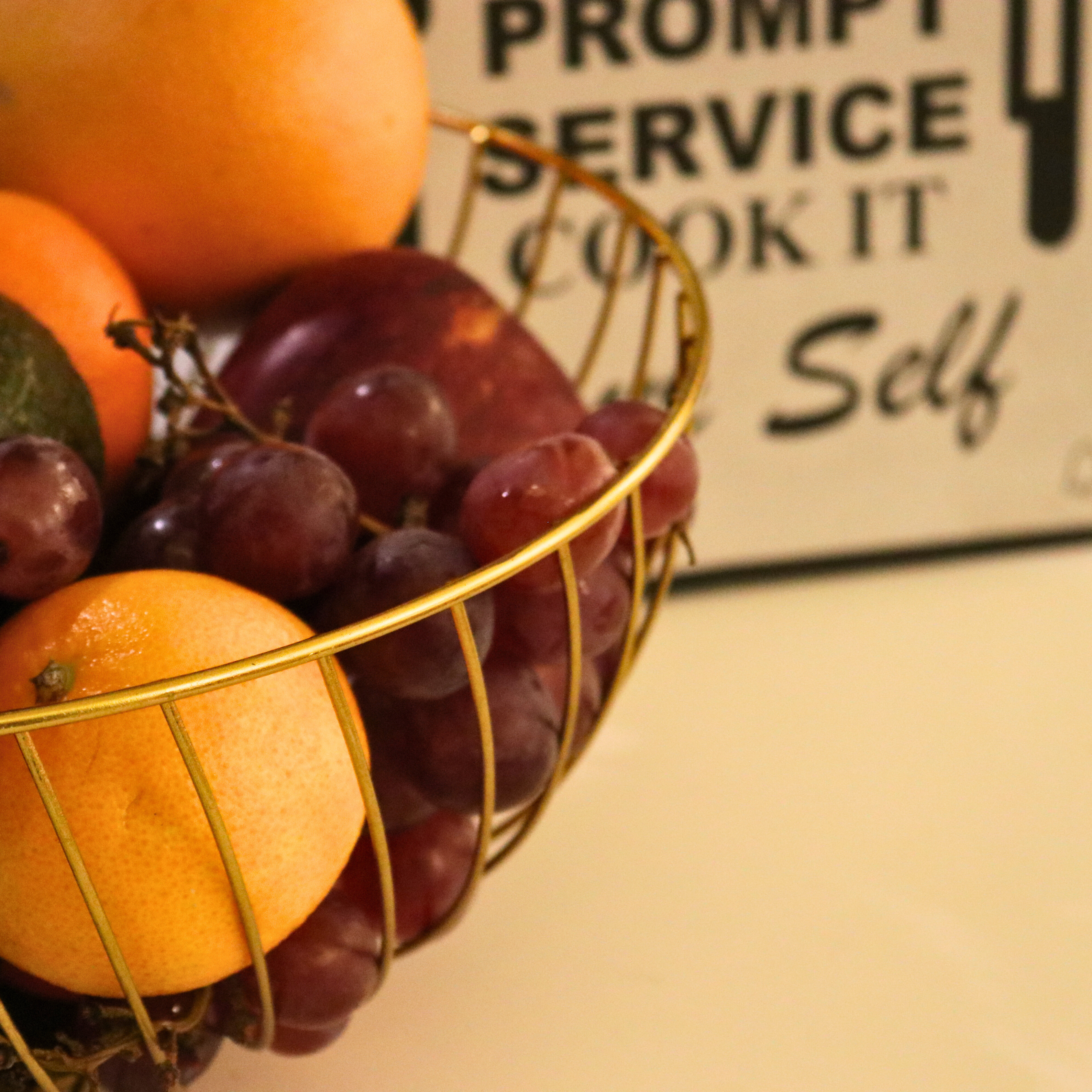 Close-up view of the intricate spiral design on the Gold Electroplated Spiro Iron Fruit Basket