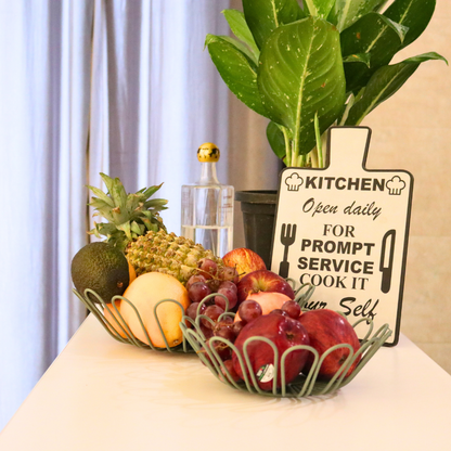 Naomi Green food-safe fruit basket made of iron, featuring a textured powder-coated finish, perfect for storing and displaying fresh fruits in a stylish and durable way