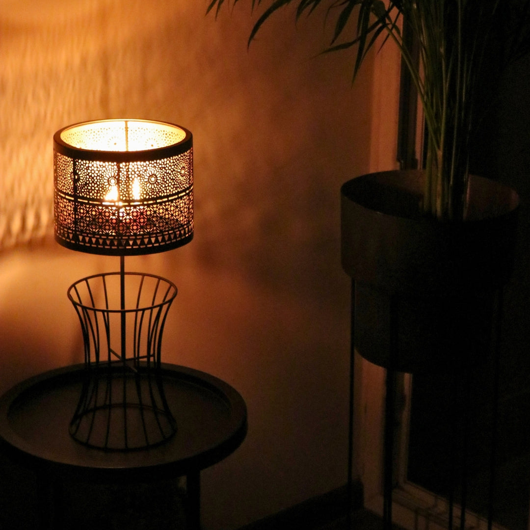 Christen Candle Table Lamp made of iron with a plated copper and gold finish, designed to hold 4 candles.