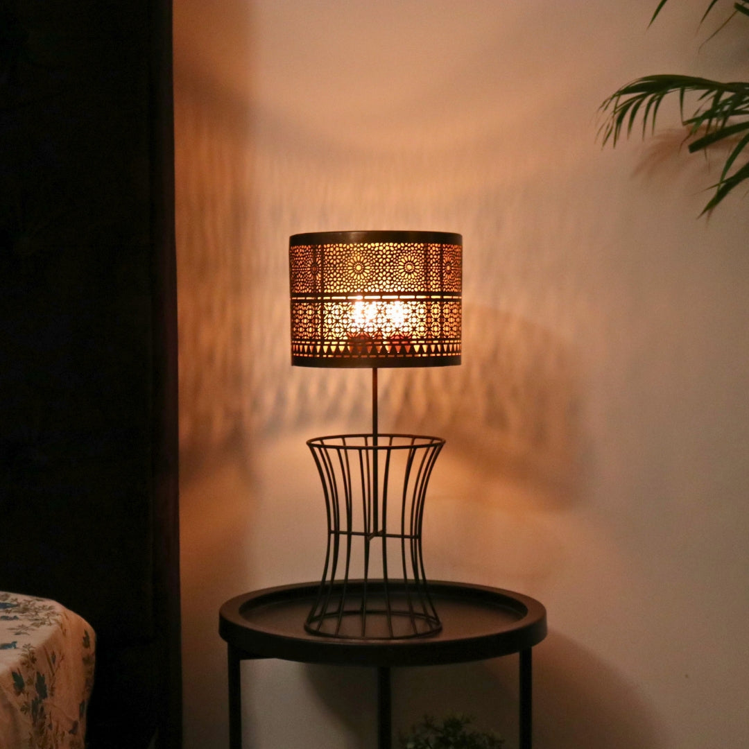 Christen Candle Table Lamp made of iron with a plated copper and gold finish, designed to hold 4 candles.