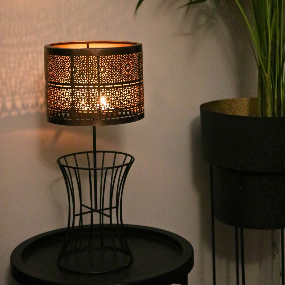 Christen Candle Table Lamp made of iron with a plated copper and gold finish, designed to hold 4 candles.