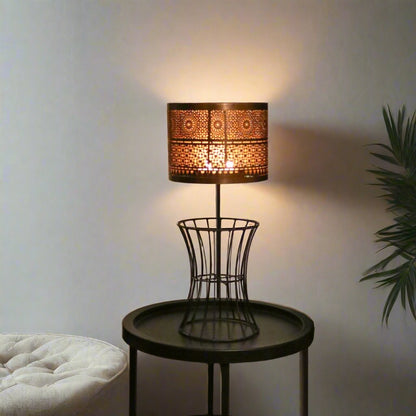 Christen Candle Table Lamp made of iron with a plated copper and gold finish, designed to hold 4 candles.